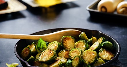 brussel sprouts in a pan on a kitchen worktop