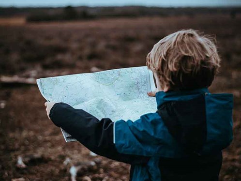 Boy reading a map