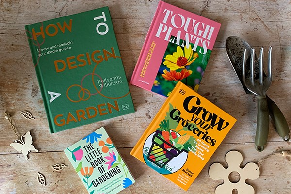 Gardening books spread out on a rustic background