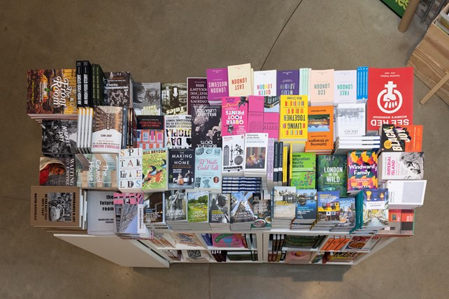 Piles of books laid out in a retail setting