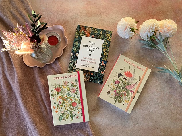 Floral themed books spread out in a display